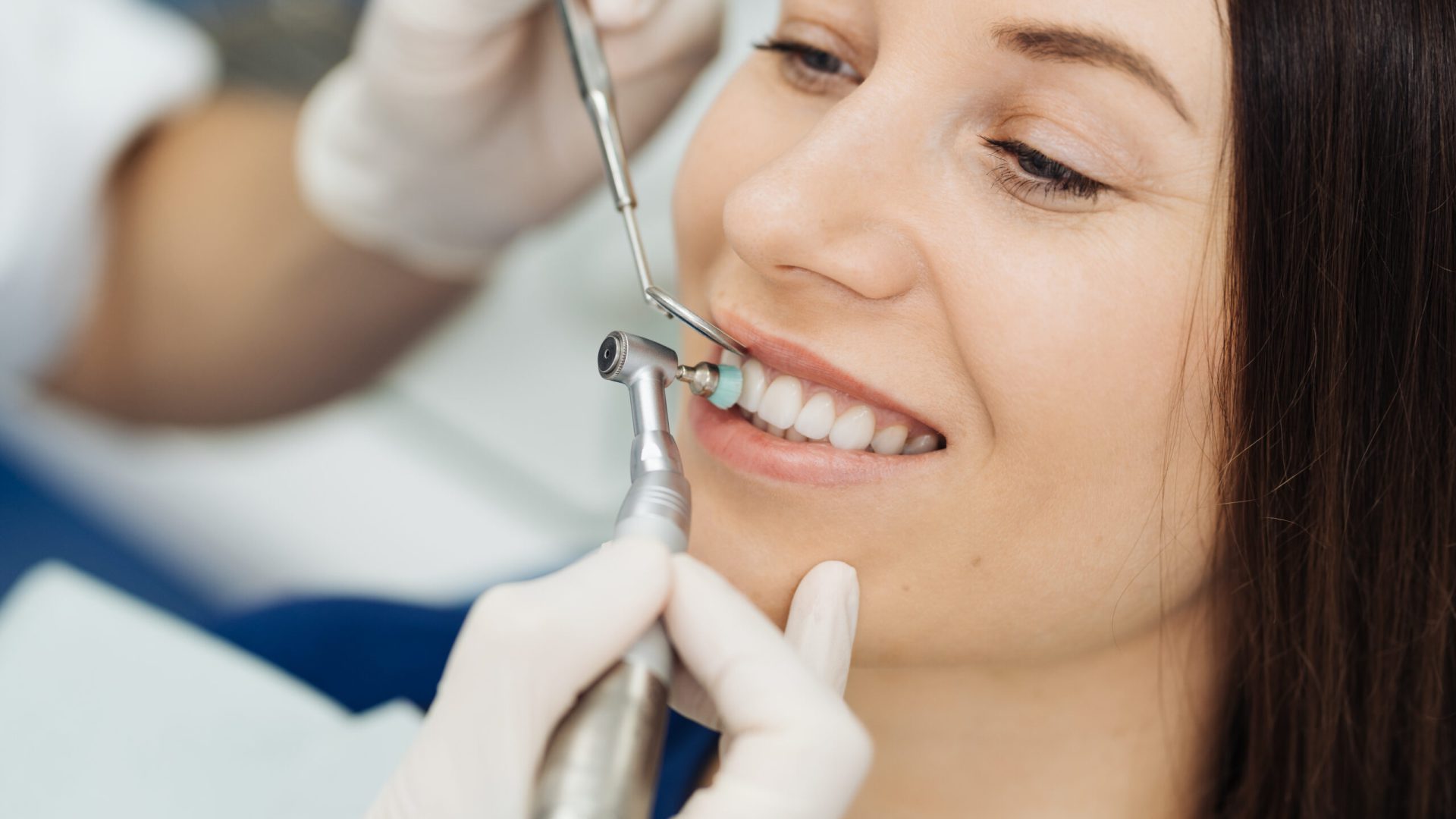 Overview of dental caries prevention. Girl at the dentist chair during a dental scaling procedure. Healthy Smile.